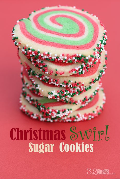 Christmas Swirl Sugar Cookies stacked up on a red background